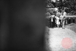 Wedding guests arriving at Dodford Church walking up the path