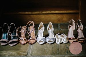 Bride and Bridesmaids shoes lined up against the steps at Dodford Manor