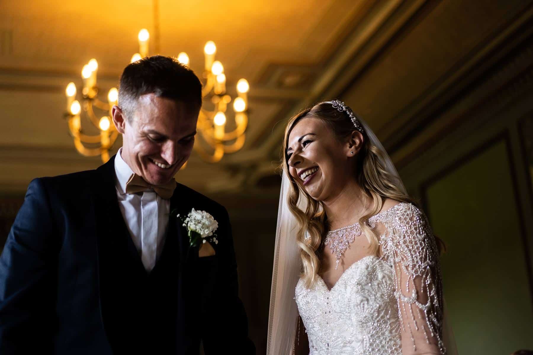 Bride and Groom laughing after just getting married