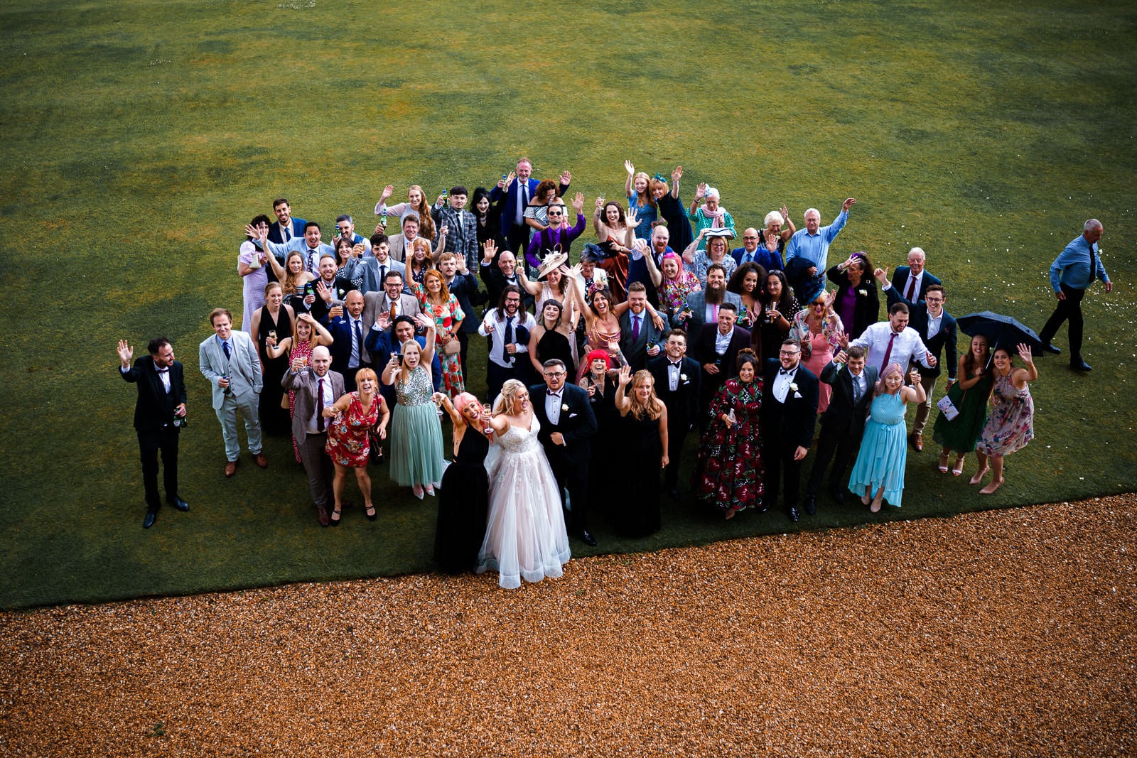 Large group photo of all wedding guests at holdenby house