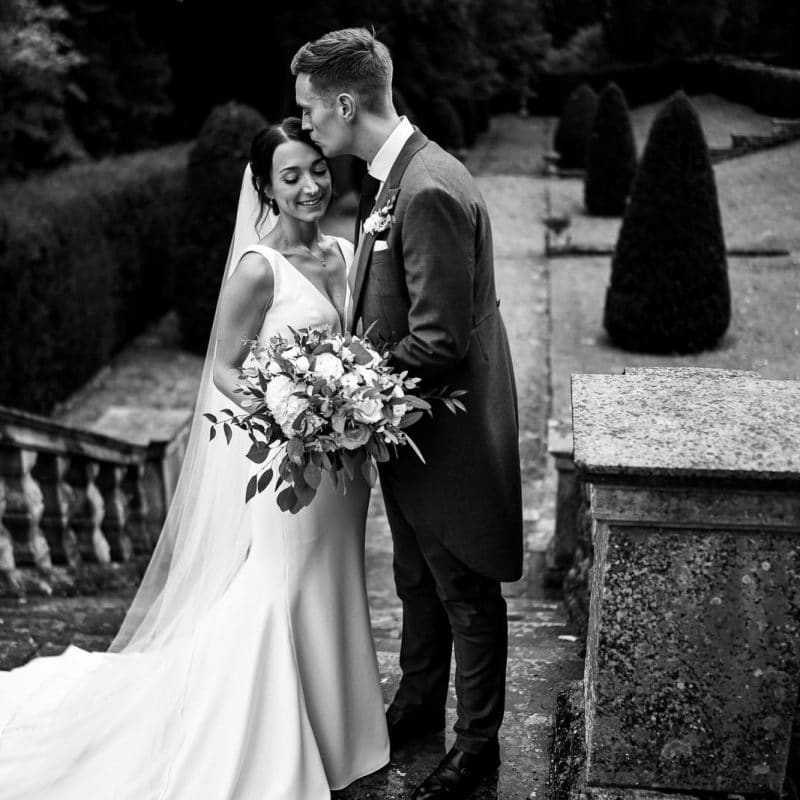 Timeless Rushton Hall Wedding Photography of flowers and the couple