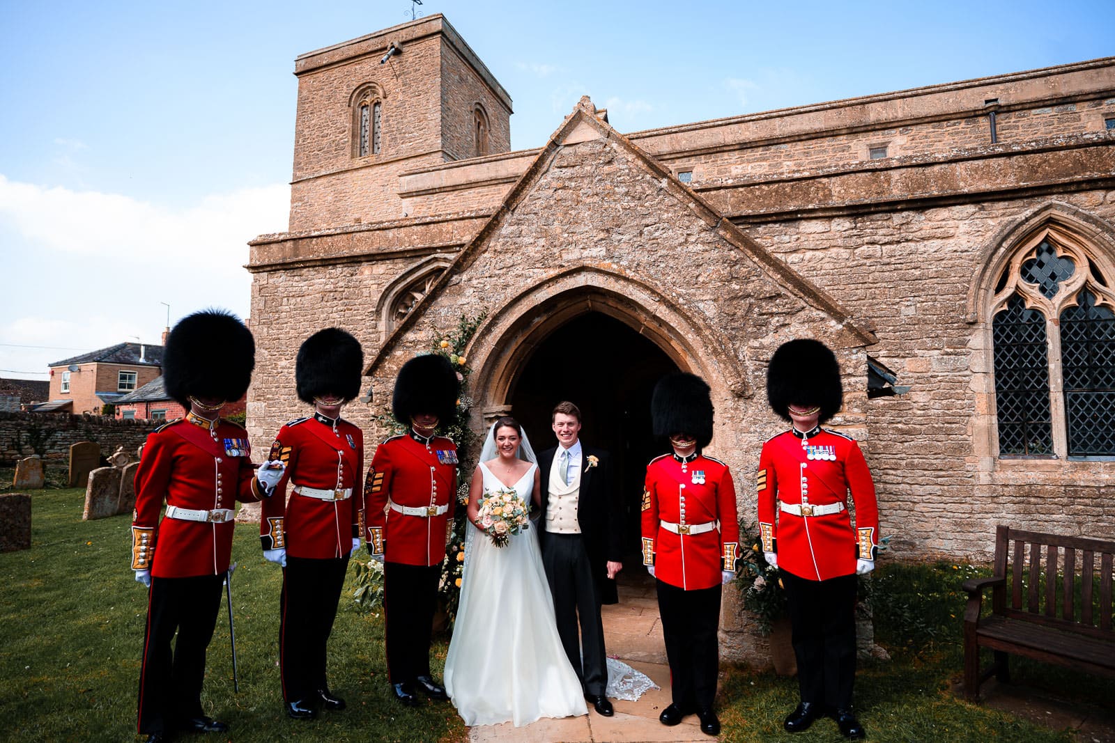 Bride and Groom with the Welsh guards at a church