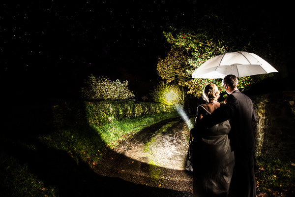 winter low light wedding photographer 8 Couple with umbrella on dimly lit country path